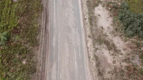 Top down view from above on dirt dusty and empty road. Without traffic. Stock Footage 140813234
