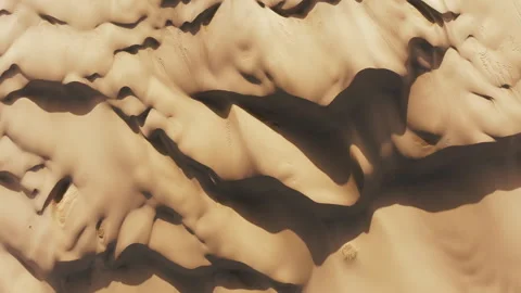 Top down view abstract wavy pattern beige golden sand desert surface at sunset 스톡 동영상 241687953