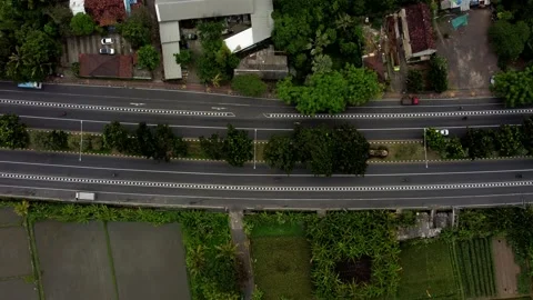 Top down view aerial road in cloudy day in Bali Stock Footage 154552579