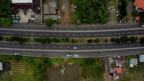 Top down view aerial road in cloudy day in Bali Stock Footage 154621529