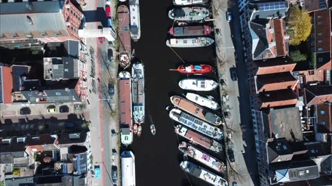 Top down view along canal with houseboats. Video stock 182097937