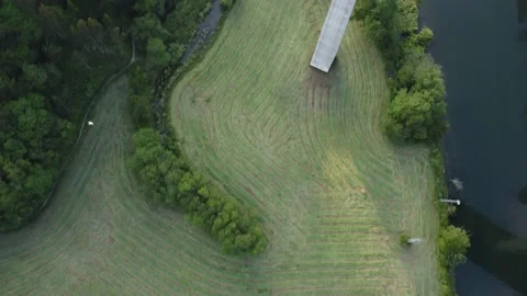 Top down view along river over fields, highway, Cueva village &amp; beach, Asturias Video stock 155589087