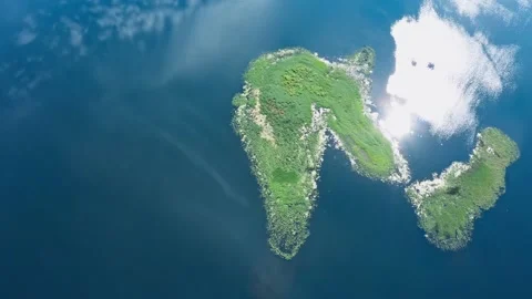 Top down view amazing lake, picturesque islands covered with trees and meadows Stock Footage 136257646