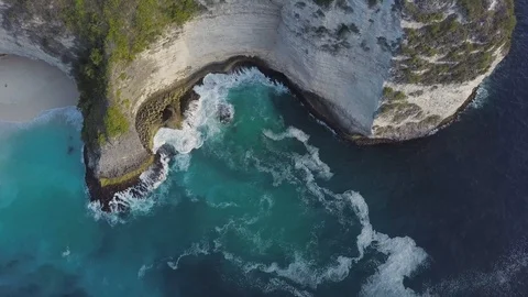 Top down view of amazing turquoise ocean waves hitting the rocks aerial footage Stock Footage 101670436