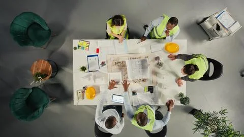 Top down view of architects working on real estate investment plan Stock Photos
