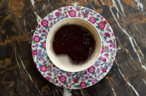 Top-Down View of Aromatic Coffee on Floral Pink Service Stock Photos