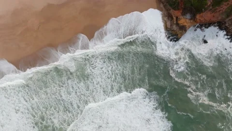 Top down view of Atlantic ocean waves crashing on an empty sand beach in Na.. Stock Footage 239578079