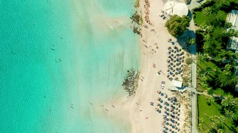Top down view of Ayia Napa famous Nissi Beach, Cyprus with tropical umbrellas Video stock 293171197