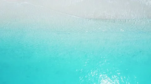Top down view of beach with blue sea and white sand. Stock Footage 155729093