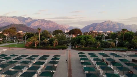 Top down view of a beach with tourists sunbeds and umbrellas with sand beach and Stock Footage 158577416