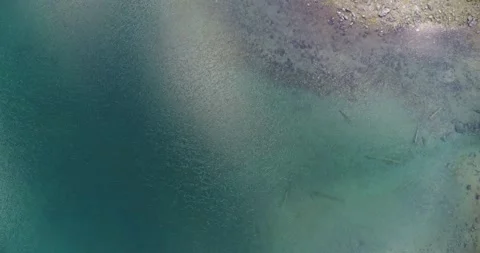 Top down view of beautiful Alpine Lake. Clear Water in Lake. Stock Footage 197441653