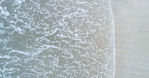 A top down view of the beautiful and mesmerizing texture of sea foam during.. Stock-Footage 327836701