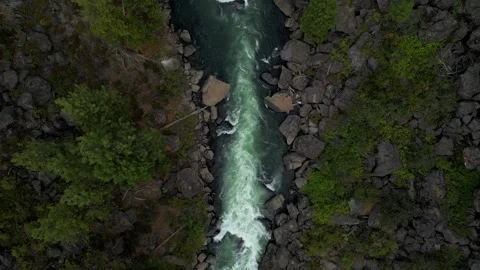 Top Down View of Beautiful White Water Churning on Sunny Day with Rocks Video stock 249822845