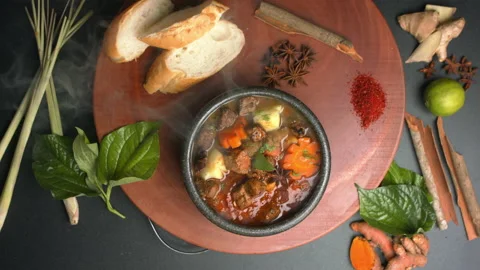 Top down view of Beef hotpot on a wooden board with spices Stock Footage 157842867