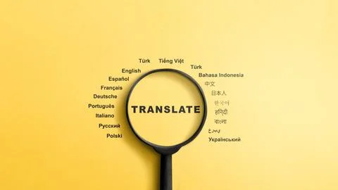 A top-down view of a black magnifying glass focusing on the word translate,.. Stock Photos