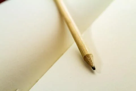 Top down view of a blank textbook with a dark wood table isolated with a pencil Stock Photos