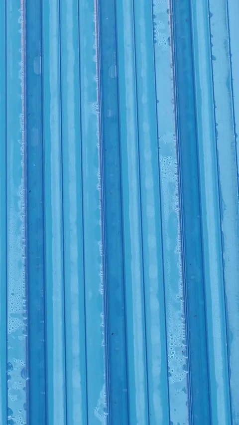 Top-down view of blue pool safety panels forming a strict vertical pattern. Wate Stock Footage 312753740