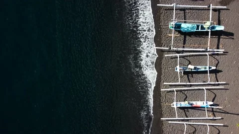 Top down view on boats on black sand beach Stock Footage 158827470