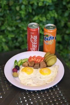 Top-down view of a breakfast plate with sunny side up eggs Stock Photos