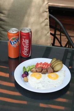 Top-down view of a breakfast plate with sunny side up eggs Stock Photos