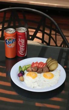 Top-down view of a breakfast plate with sunny side up eggs Stock Photos