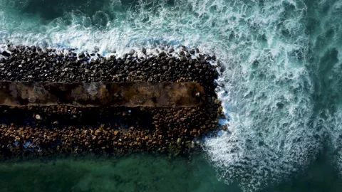 Top down view on breakwater a far from the beach Stock Footage 153349175