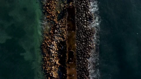 Top down view on breakwater a far from the beach Stock Footage 154361303