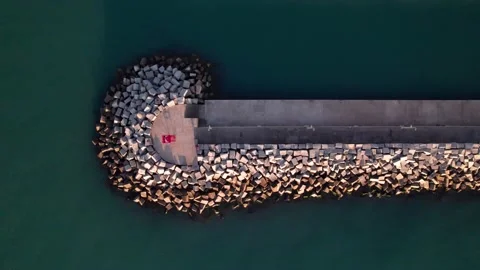 Top down view on breakwater a far from the beach Stock Footage 220688511