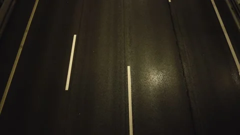 Top-down view from the bridge at night traffic on the highway in the city Stock Footage 161141682