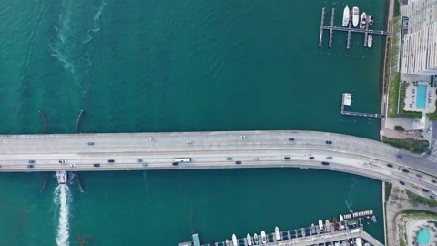 Top down view on a bridge over the scenic bay. 4K aerial of road with traffic Stock-Footage 134476609