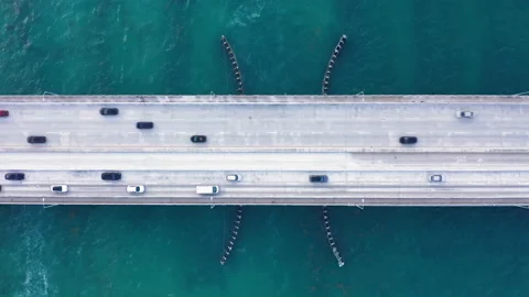 Top down view on a bridge over the scenic bay. 4K aerial of road with traffic 스톡 동영상 134479329