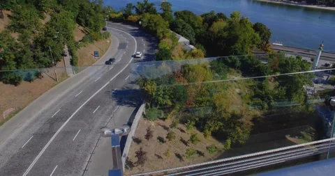 Top down view from the bridge to the river and the road. 스톡 동영상 159787815