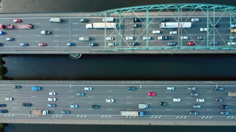 Top down view on bridge with traffic over river. Cars in motion. Chase by drone. Stock Footage 140271570
