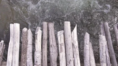 Top down view of bubbly water flowing under a wooden bridge in the river. Stock Footage 130572199
