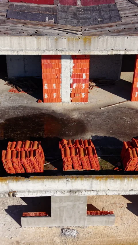 Top down view of building levels with red tiles Vertical video. Stock Footage 332343620