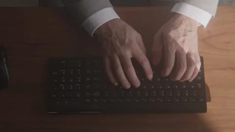 Top Down View of a Businessman Typing on a Computer Keyboard Stock Footage 270306655