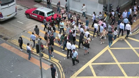 Top-Down View of Busy Intersection in Hong Kong with Pedestrians at Zebra 動画素材 294506954