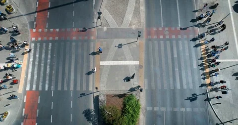 Top down view of busy pedestrian cross during sunny day 스톡 동영상 100358045