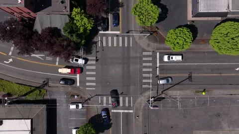 Top-down View Of A Busy Urban Intersection With Marked Crosswalk In Downtown Video stock 336033731