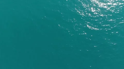 Top-down view, the camera flies over the sea waves on a clear day. Stock Footage 220423633