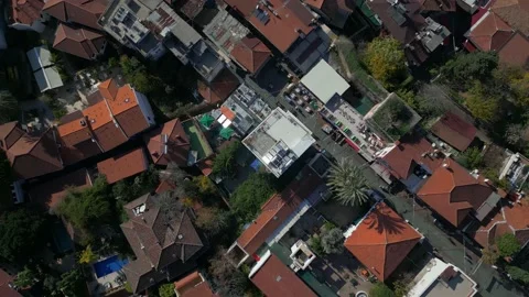 Top-down view, the camera flies over the red tiled roofs. Stock Footage 229614140