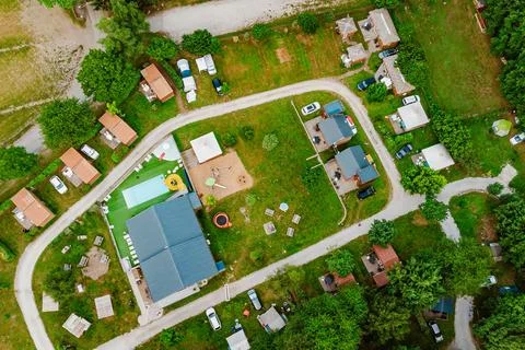 Top down view of camping with cabins, bungalows, caravans, swimming pool, p.. 库存照片