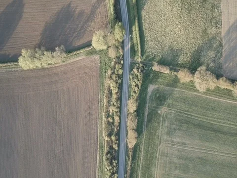 Top down view of car driving through countryside Stock Footage 79247841