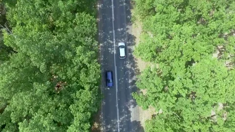 Top down view of car driving along asphalt road Stock Footage 143939973