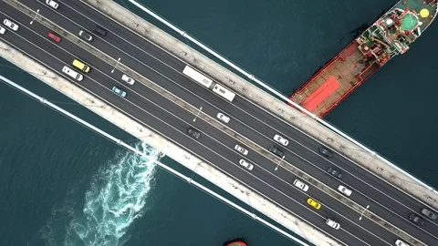 Top down view of car traffic on the bridge across the sea. Aerial. Towing convoy Stock Footage 109238027