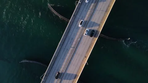 Top down view of cars driving on Haulover Inlet Bridge in Miami - Drone shot 4k Stock Footage 243320490