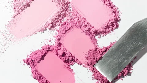 Top-down view of chaotic pink powder smears for blush promotion Stock Footage 337470565