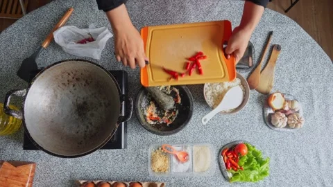 Top-down view of chef chopping red chilies and grinding them into spice mixture Stock Footage 342677742