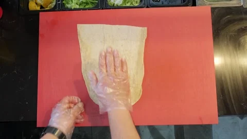 Top Down View of Chef Placing Flatbread to Prepare Wrap Stock Footage 336212514