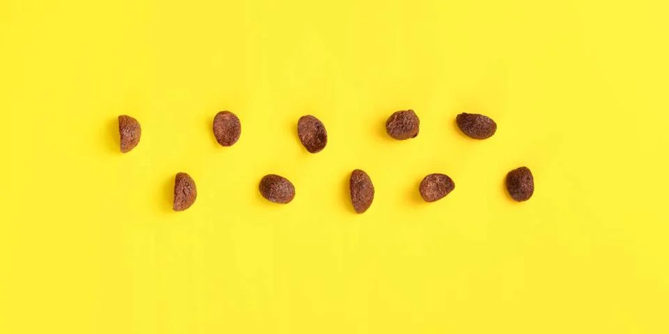 Top down view, chocolate cornflakes on yellow board. Top down view, chocol... Stock Photos